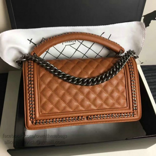 Ch**el caviar grained calfskin boy bag with top handle orange